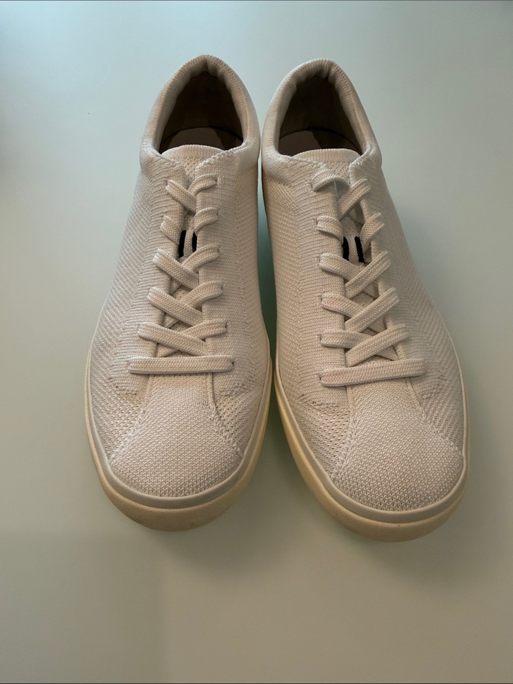 Rothy's Women’s Knit Sneakers in White Mesh with Black Heel Accent Stripe